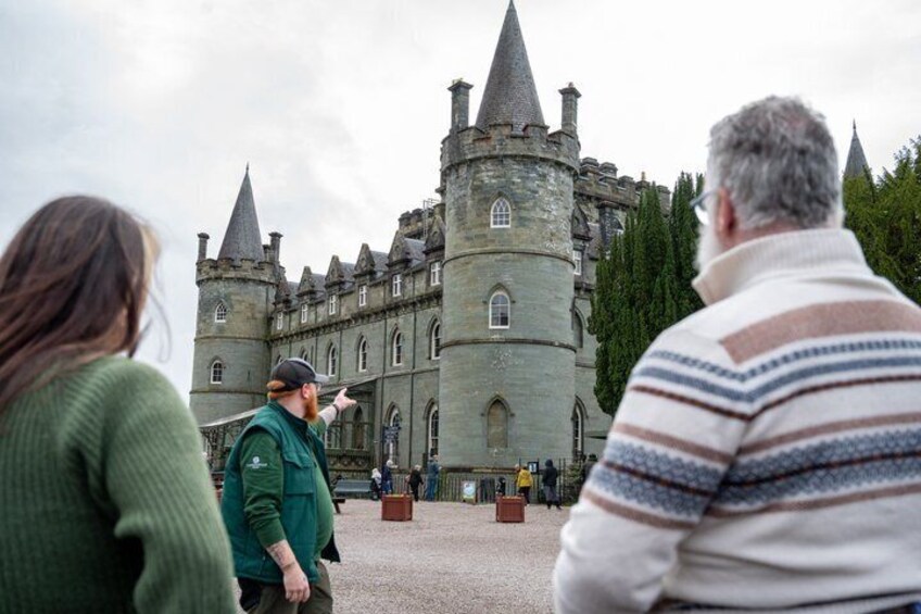 A historic castle with multiple towers and a large courtyard. 5