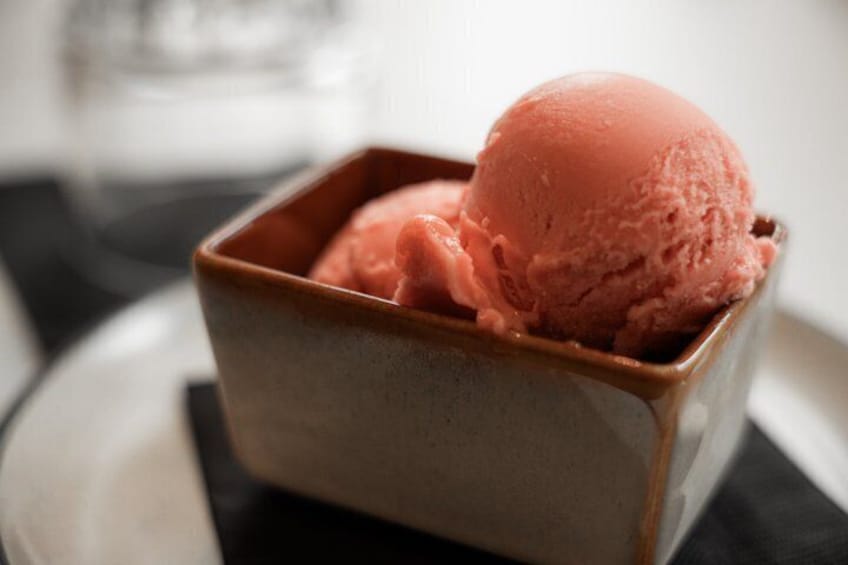 A bowl of pink ice cream. 3