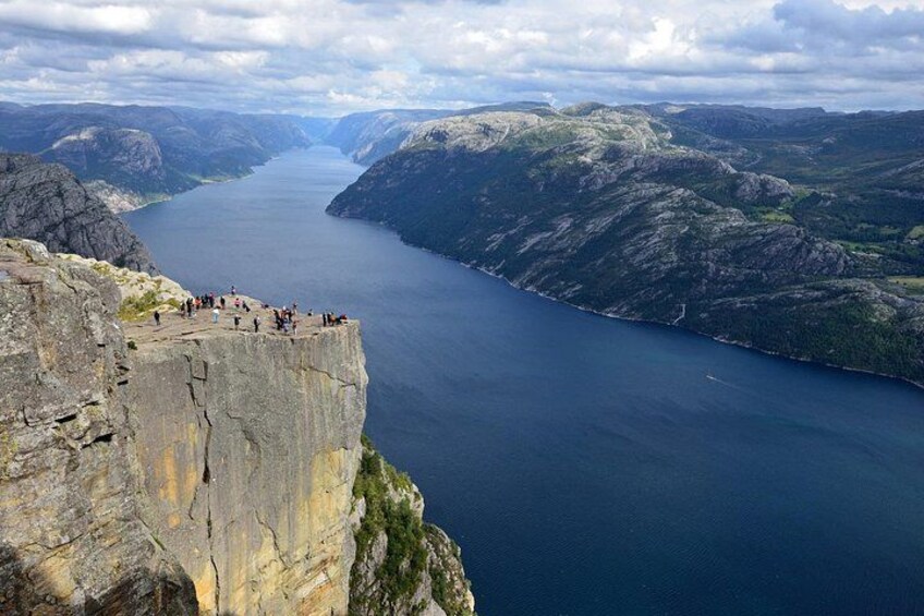A fjord with a rocky cliff overlooking the water. 2