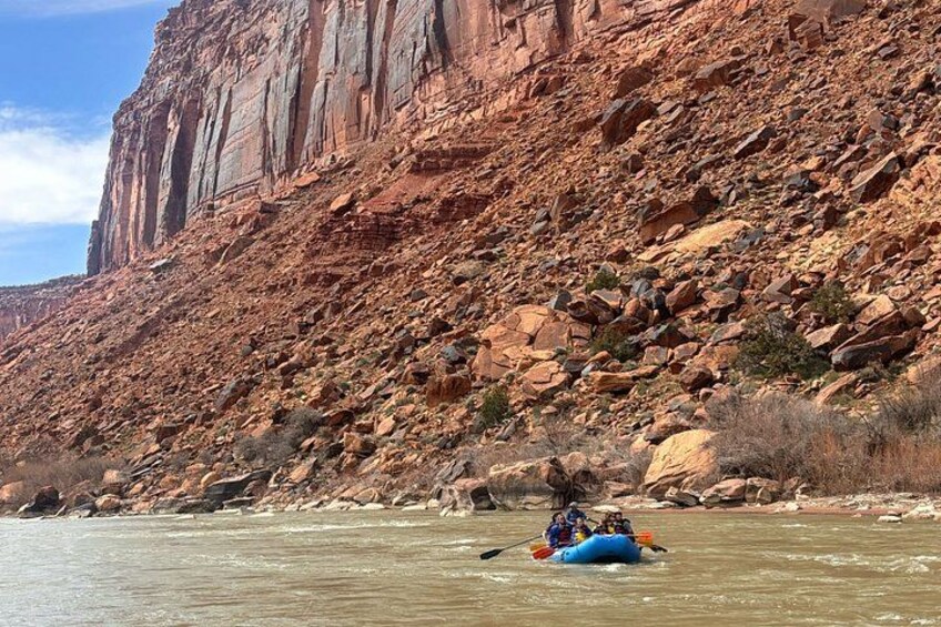 A river with a rocky canyon in the background. 2