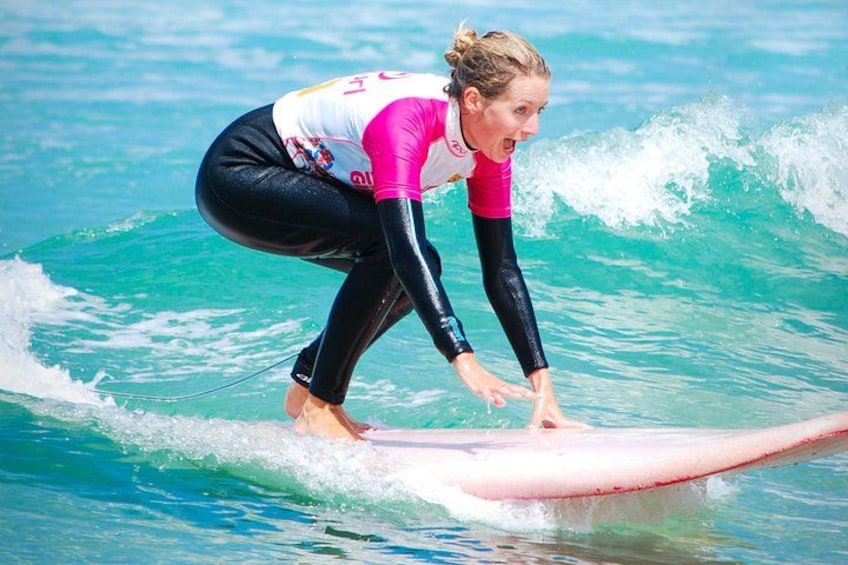 A person surfing on a wave in the ocean. 2