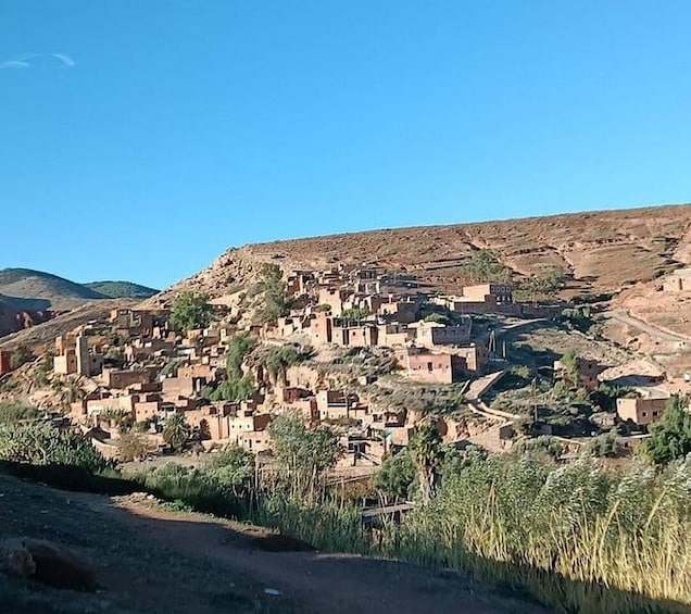 A village with traditional mud-brick houses built on a hillside. 2