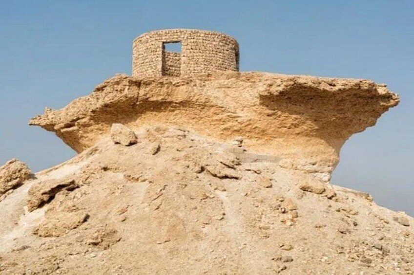 A large mound with a cylindrical structure on top. 2