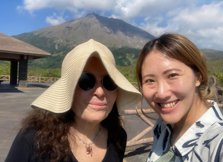 Two people with a mountain in the background. 3