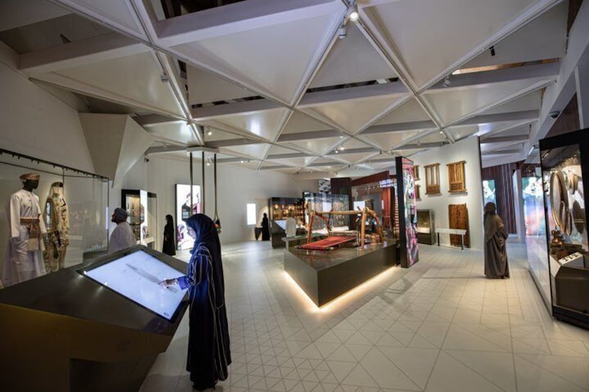 An indoor museum with exhibits and visitors. 2