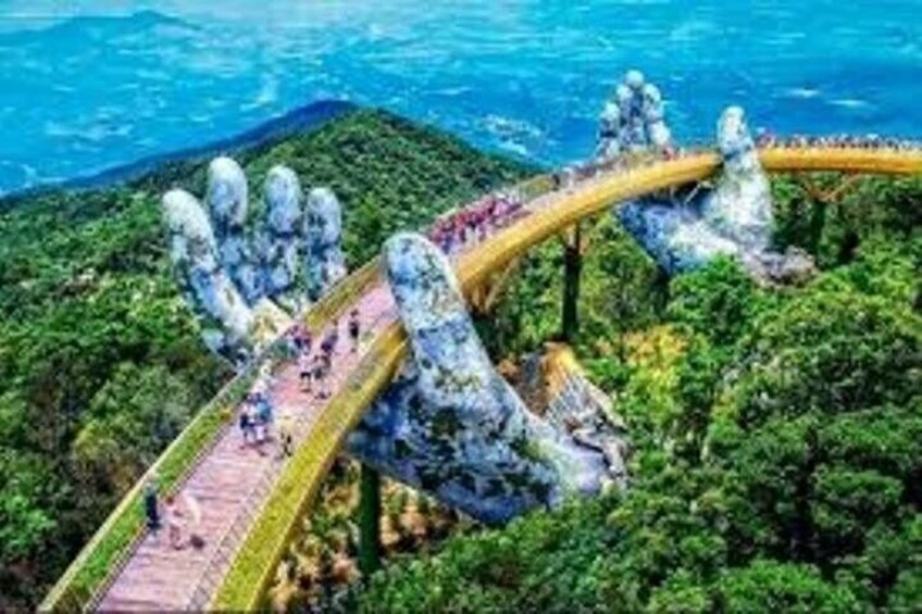 A bridge with a unique design, surrounded by lush greenery and a body of water. 3
