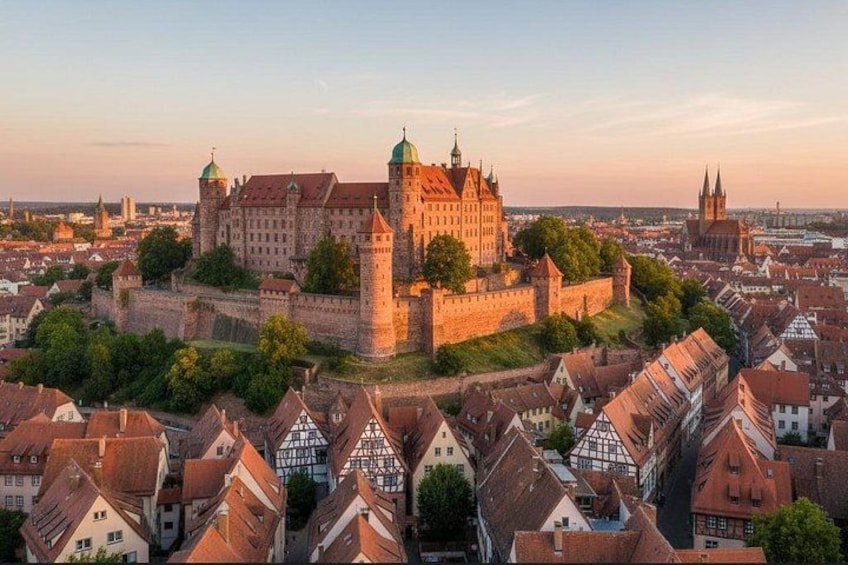 A historic castle surrounded by traditional buildings. 1