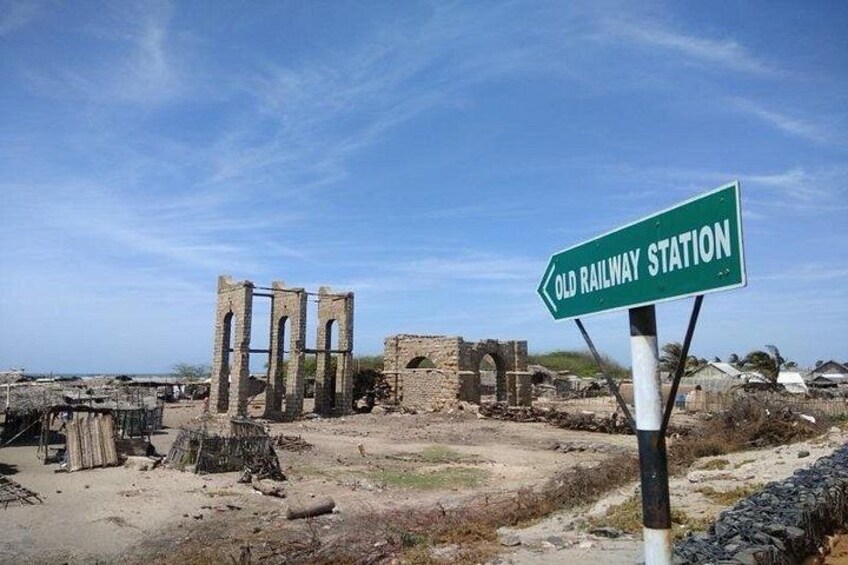 Ancient ruins with a sign for the Old Railway Station. 2