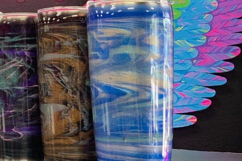 Three cylindrical containers with marbled patterns. 1