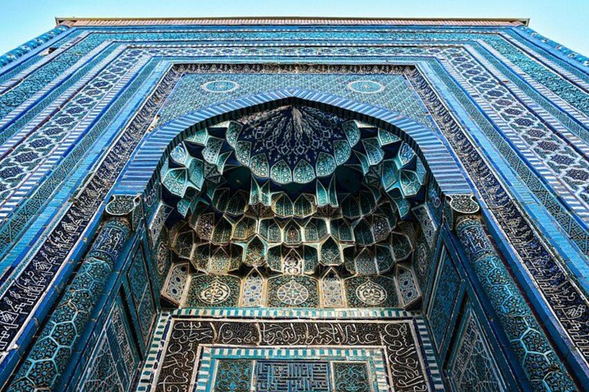 A detailed architectural structure with intricate tile work and geometric patterns. 2
