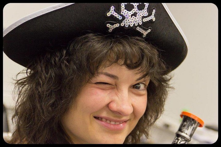 A person wearing a pirate hat with a skull and crossbones emblem. 5
