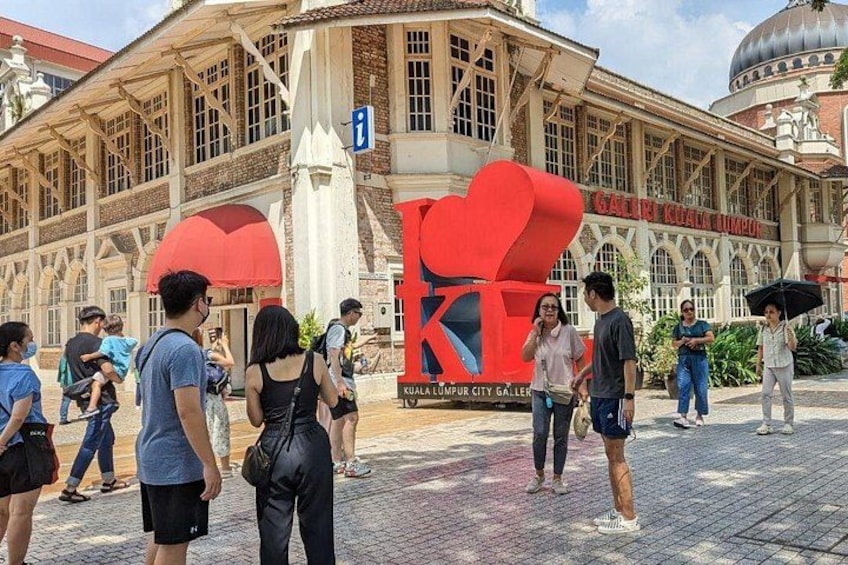 A building with a large red heart sculpture and the text 'KUALA LUMPUR CITY GALLERY'. 4