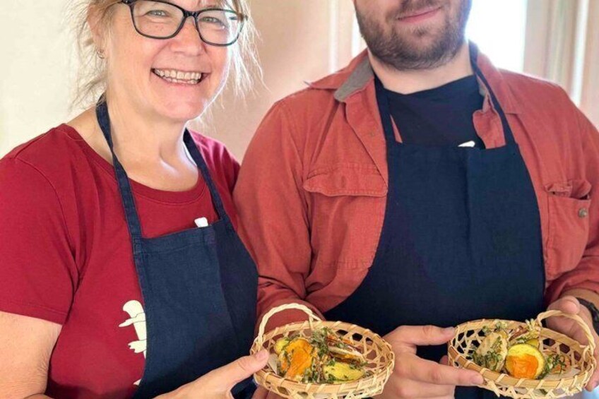 Two people holding baskets with food. 5