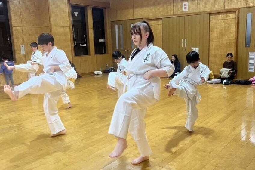 People practicing martial arts in a dojo. 1