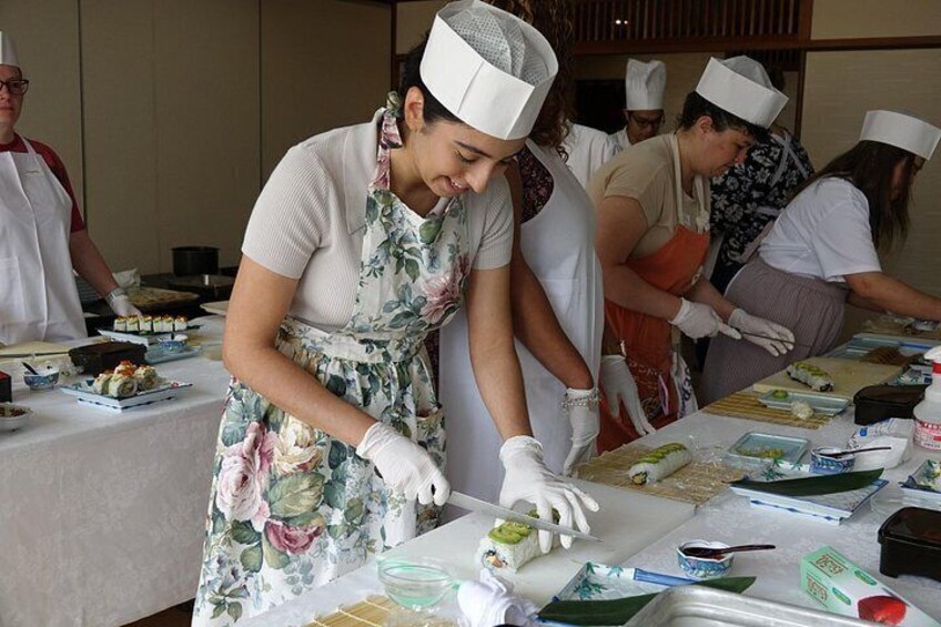 Chefs preparing food at a table. 2