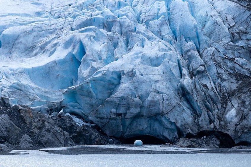 A glacier with a crevasse and a small iceberg. 2