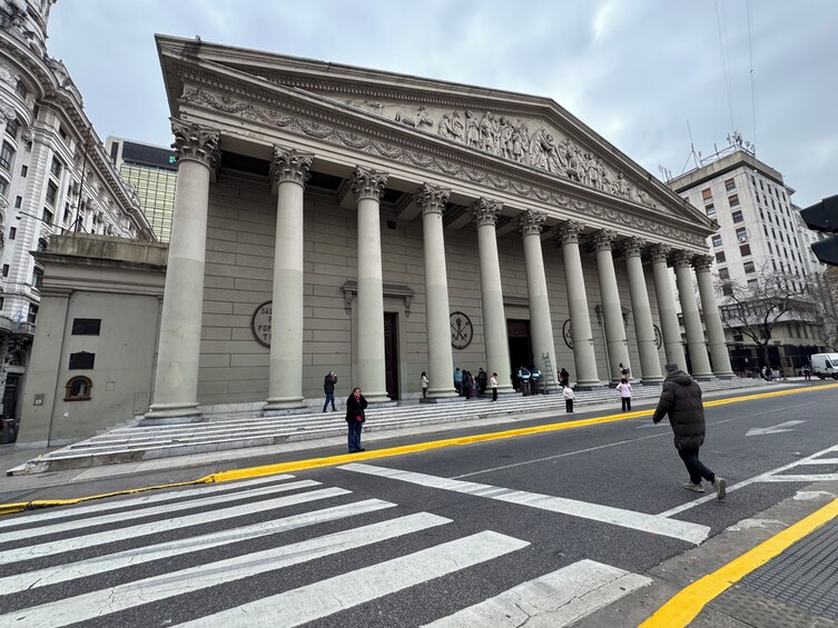 A grand neoclassical building with large columns and detailed sculptures. 4
