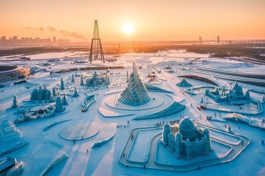 A winter wonderland with ice sculptures and a Ferris wheel. 2