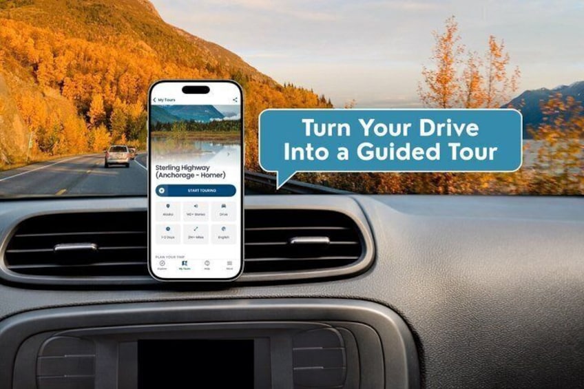 A smartphone mounted on a car dashboard displaying a guided tour app with a scenic autumn landscape in the background. 1