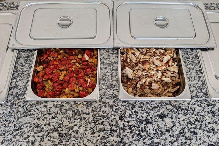 Two food dispensers on a granite countertop. 4