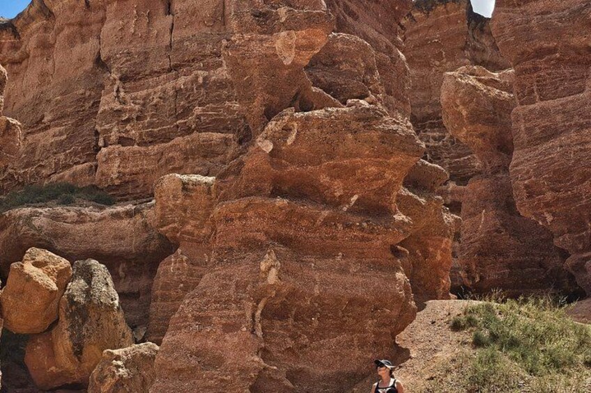 A rocky canyon with layered red rock formations. 3