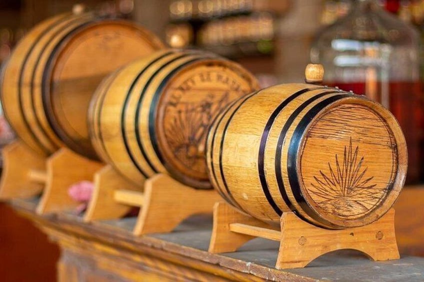 Wooden barrels with inscriptions, arranged on a wooden stand. 2