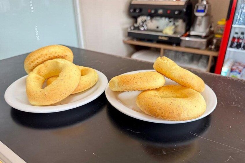 Two plates of bread rolls on a table. 4