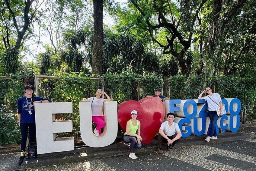 People standing in front of large letters spelling 'EUROPE' and 'FOZO GUIGU'. 1