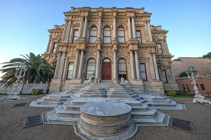A grand building with a symmetrical facade, large columns, and a central entrance. 4