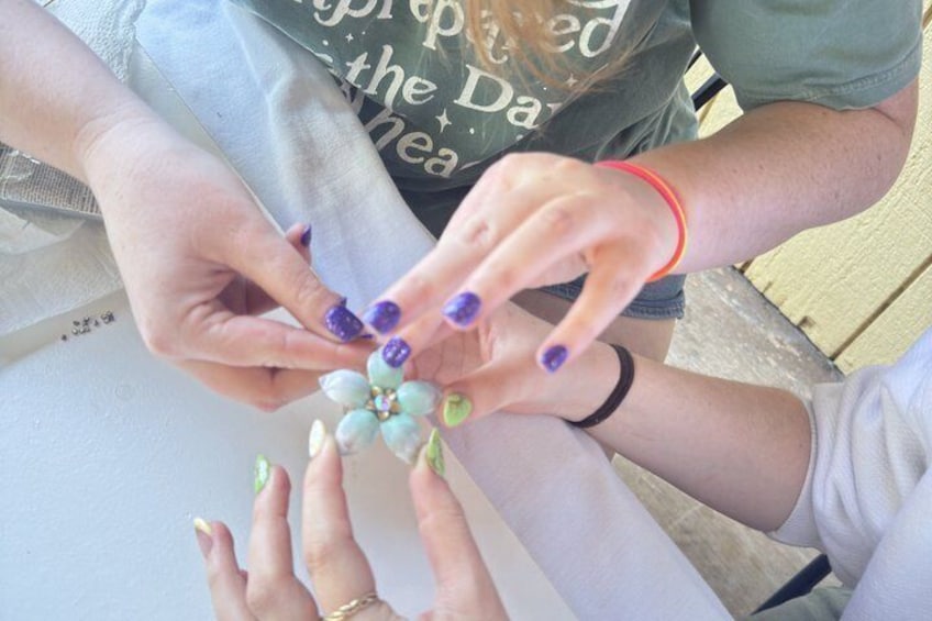 Hands holding a small bouquet of flowers. 5