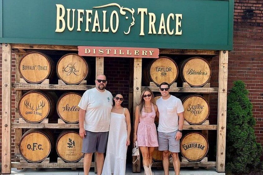 A distillery with wooden barrels labeled with names like 'Buffalo Trace' and 'Taylor's.' 4