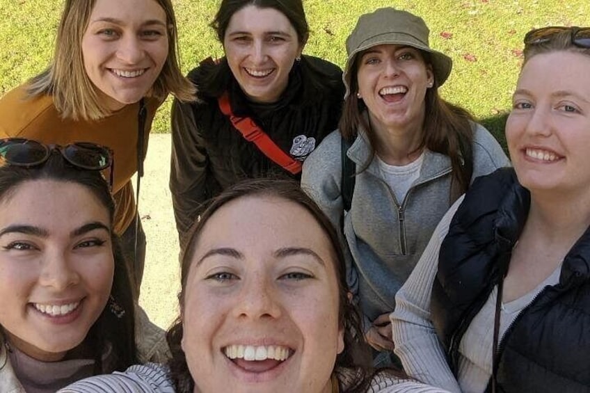 A group of people outdoors, possibly on a hike or outdoor activity. 3