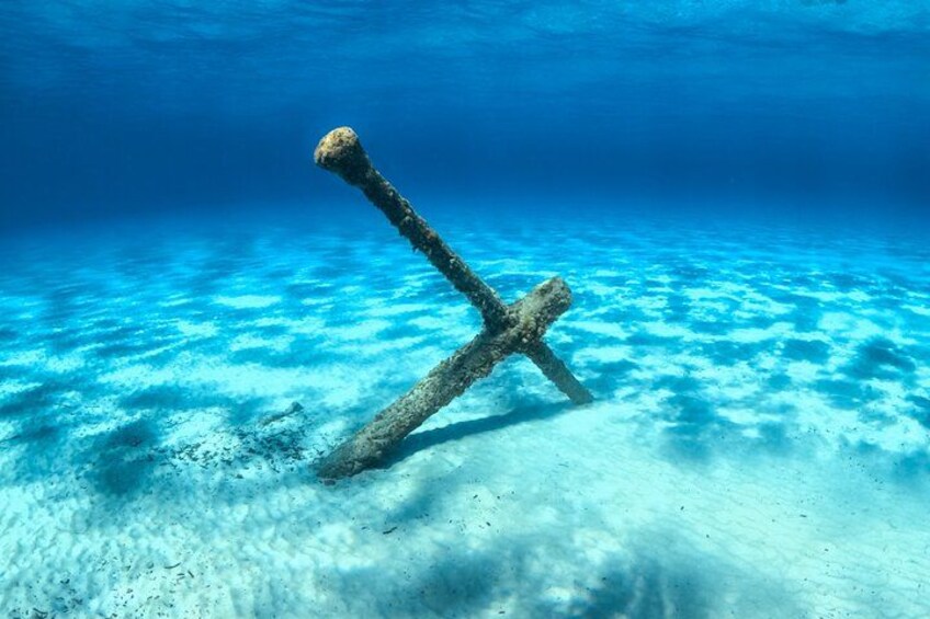 An underwater wreck with a cross-shaped structure. 4