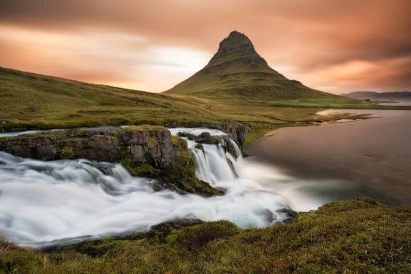 A waterfall, a lake, and a mountain. 5