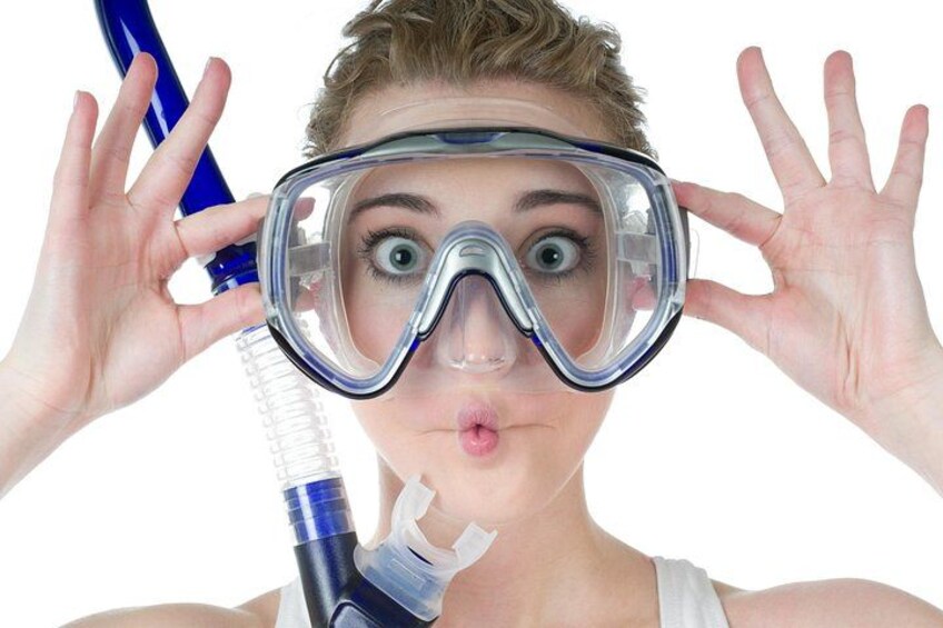 A person wearing snorkeling gear, holding a snorkel and mask. 5