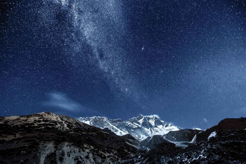 A starry night sky over a mountainous landscape. 2