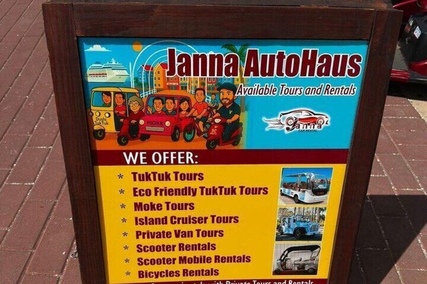 A signboard for Janna AutoHaus advertising various tours and rentals. 5