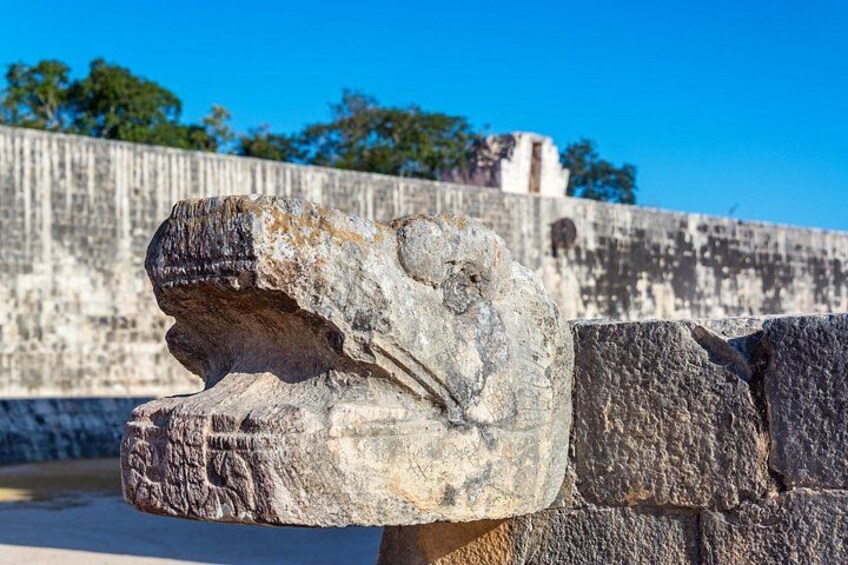 A stone lion head sculpture. 2