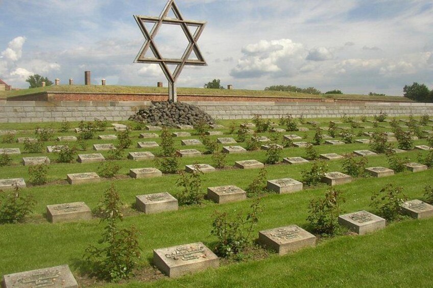 A cemetery with Star of David monuments and headstones. 3
