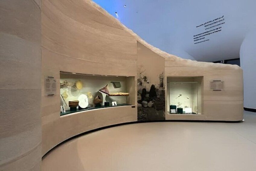 A modern interior with curved walls and recessed lighting. 5