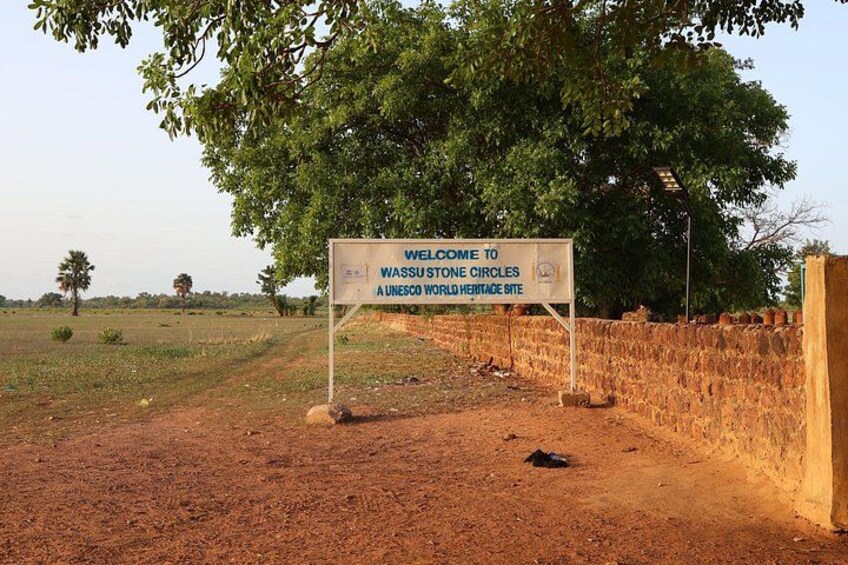 A sign welcoming visitors to the WASSU Stone Circles UNESCO World Heritage Site. 2