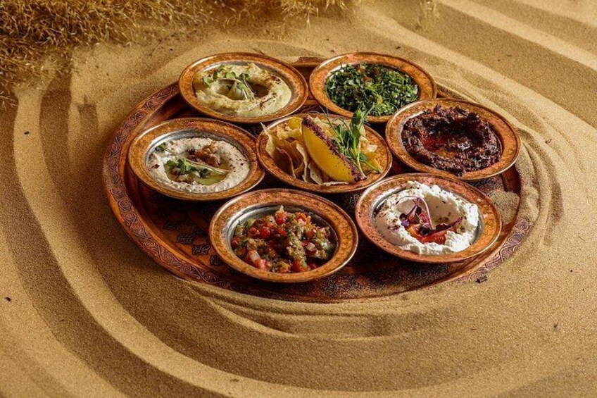 A traditional Middle Eastern platter with various dishes. 2