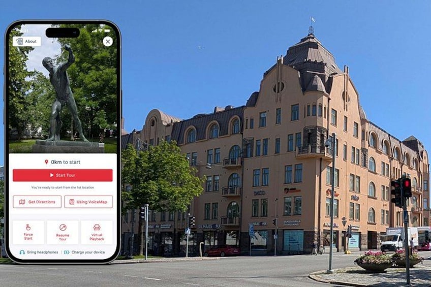 A smartphone displaying a map application with a statue and a historic building in the background. 1