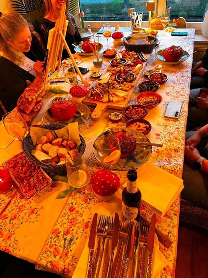 A table set with various dishes, drinks, and a bottle of beer. 2
