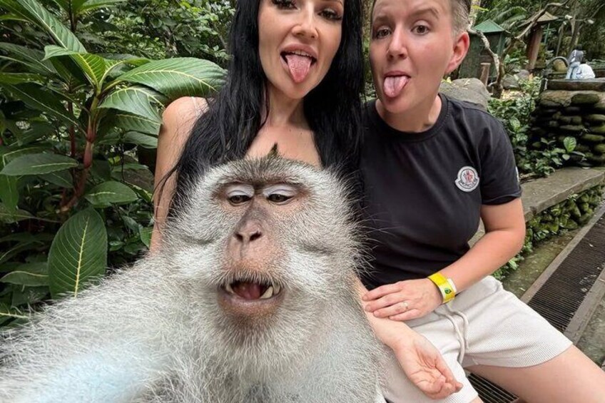 A person taking a selfie with a monkey. 5