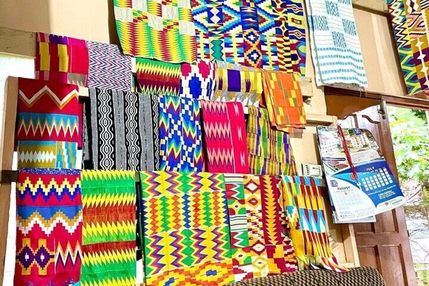 A variety of colorful woven textiles displayed on a wooden surface. 4