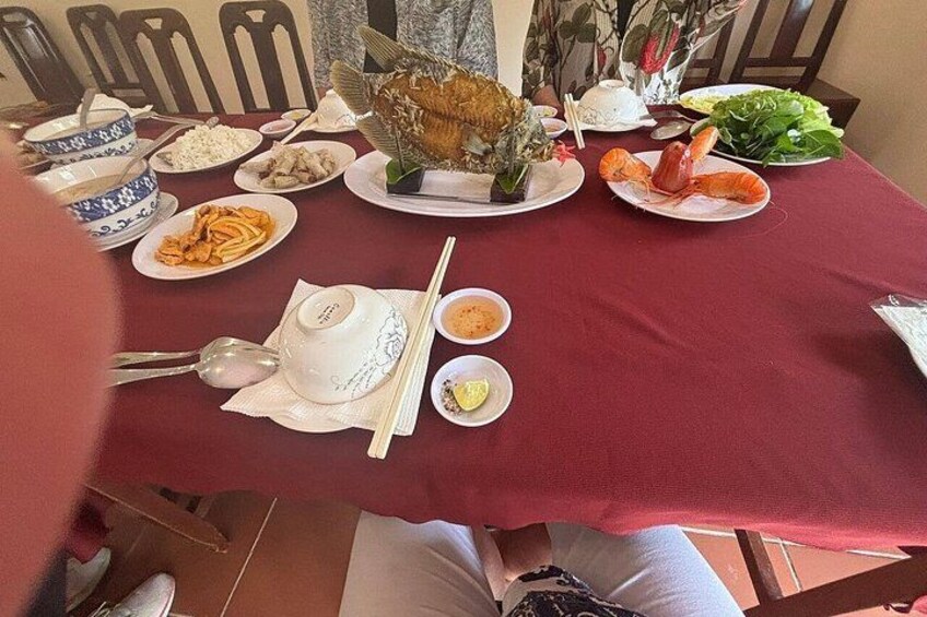 A table with various dishes, including seafood, rice, and vegetables. 3