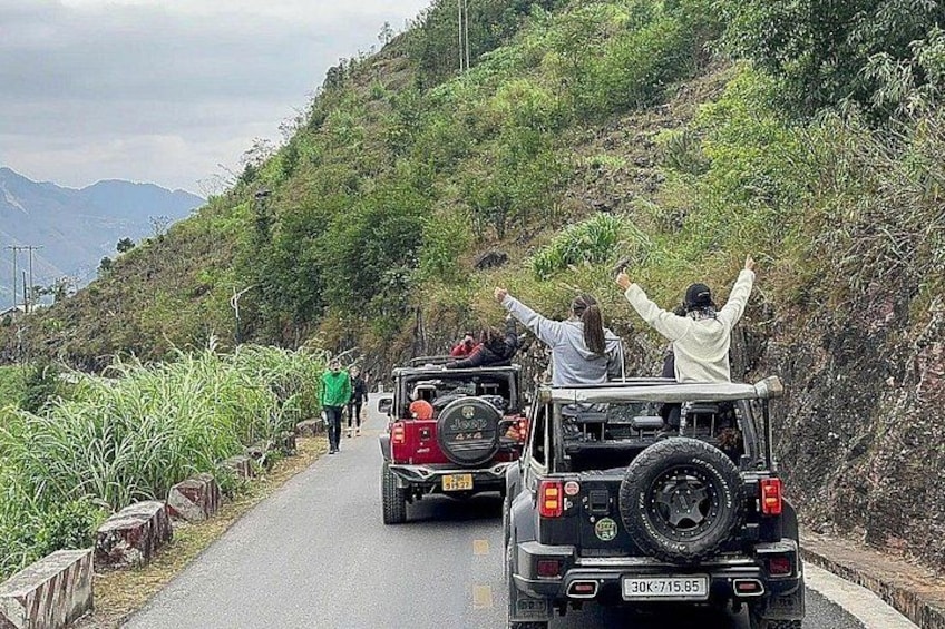 A road with vehicles and people. 5