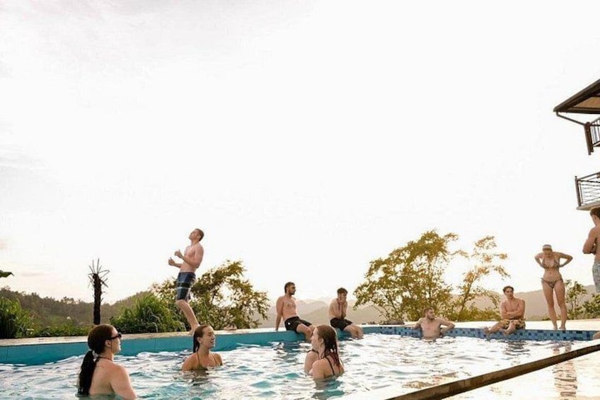 A swimming pool with people in it. 2