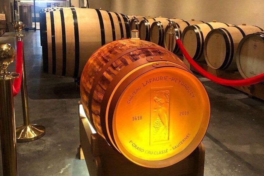 A wine barrel with the inscription 'Chateau Lafaurie-Peyragues 1618' and 'Grand Cru Classe SAUTERINES.' 5